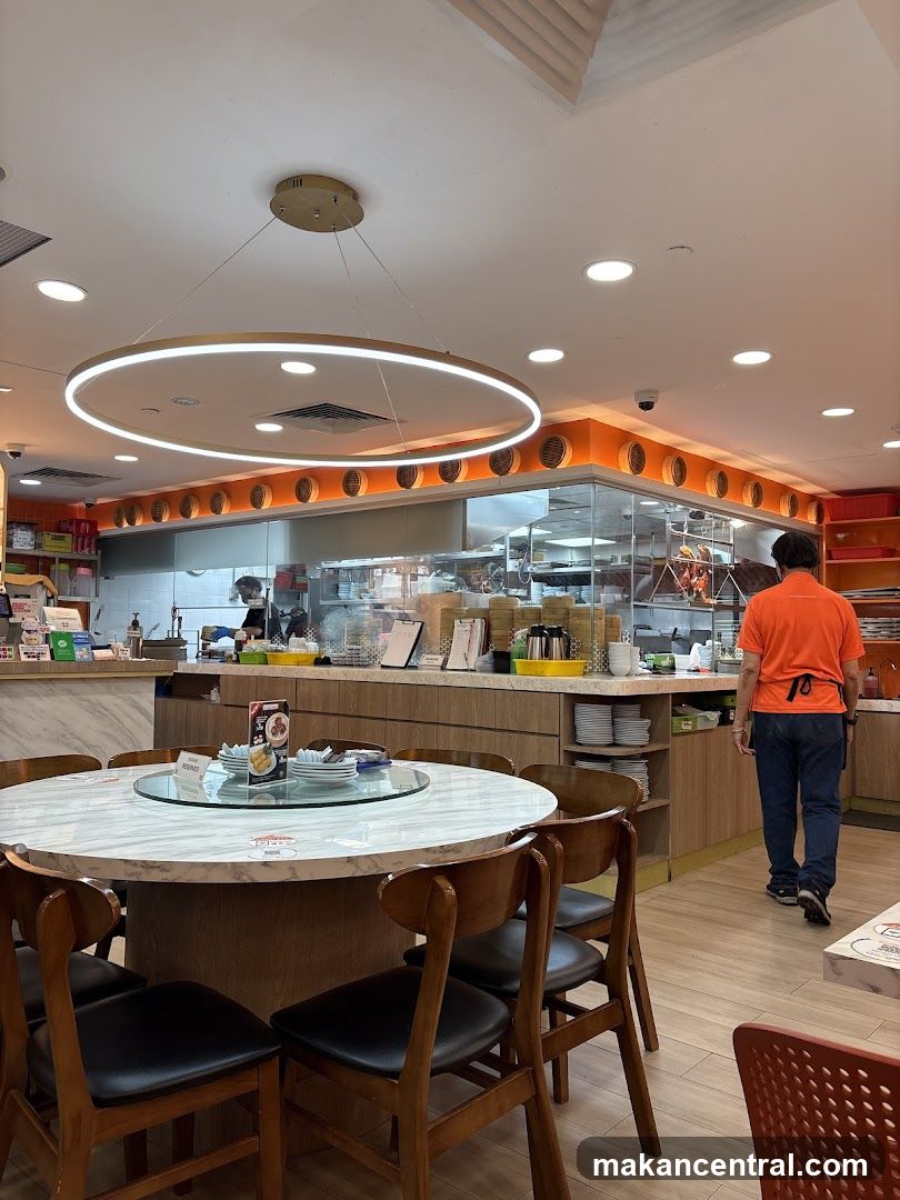 Restaurant Interior with Dining Tables and Kitchen View