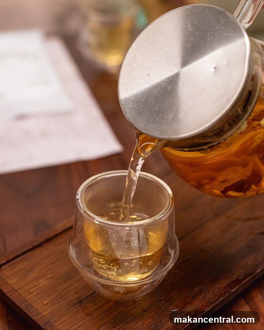 Tea being poured into a glass