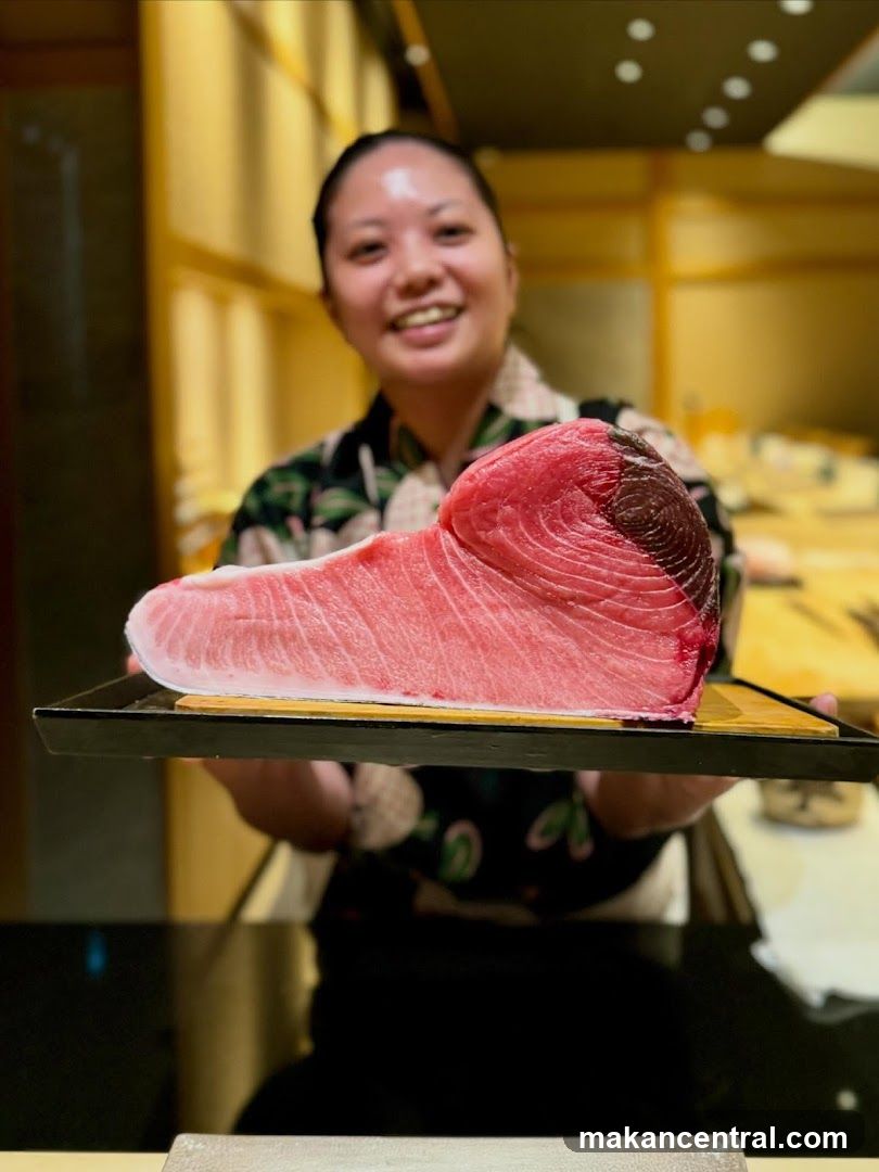 Chef holding a large piece of tuna