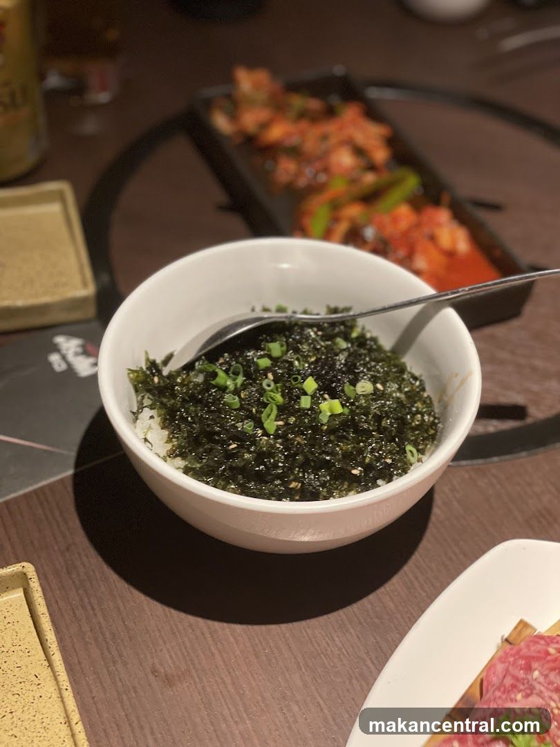 Bowl of Rice with Seaweed and Scallions