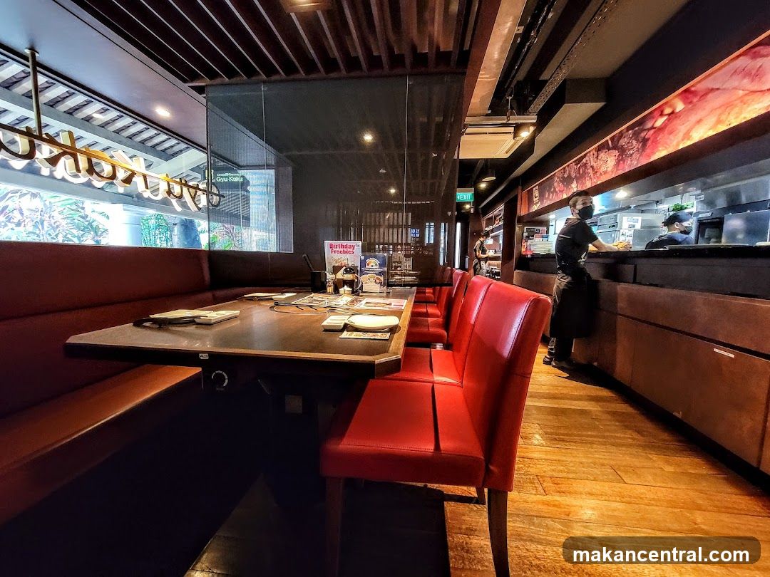 Restaurant Interior with Booth Seating and Open Kitchen