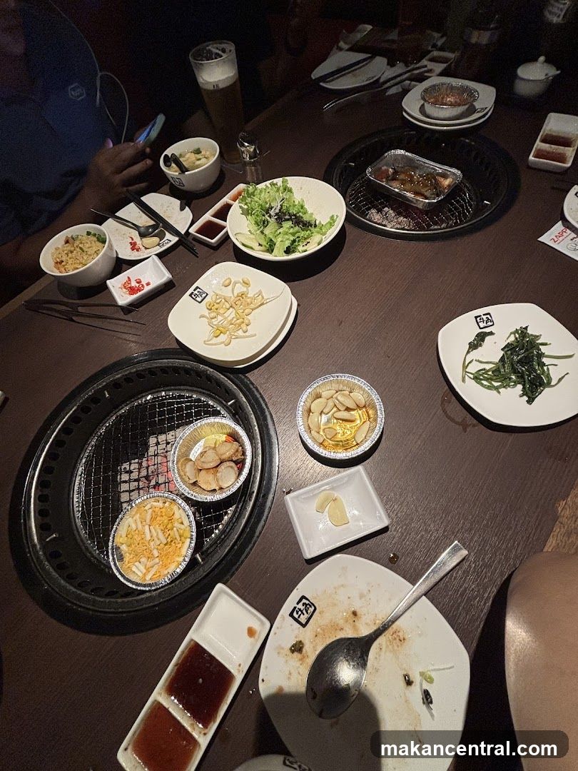 Table with Korean BBQ and side dishes