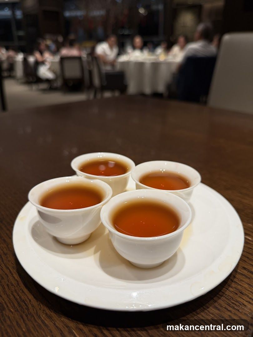Four cups of tea on a plate