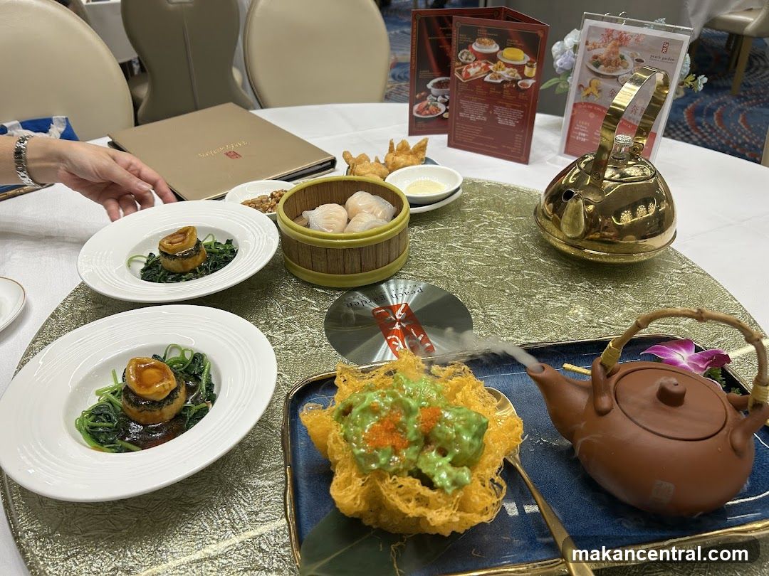 Table setting with dim sum and abalone