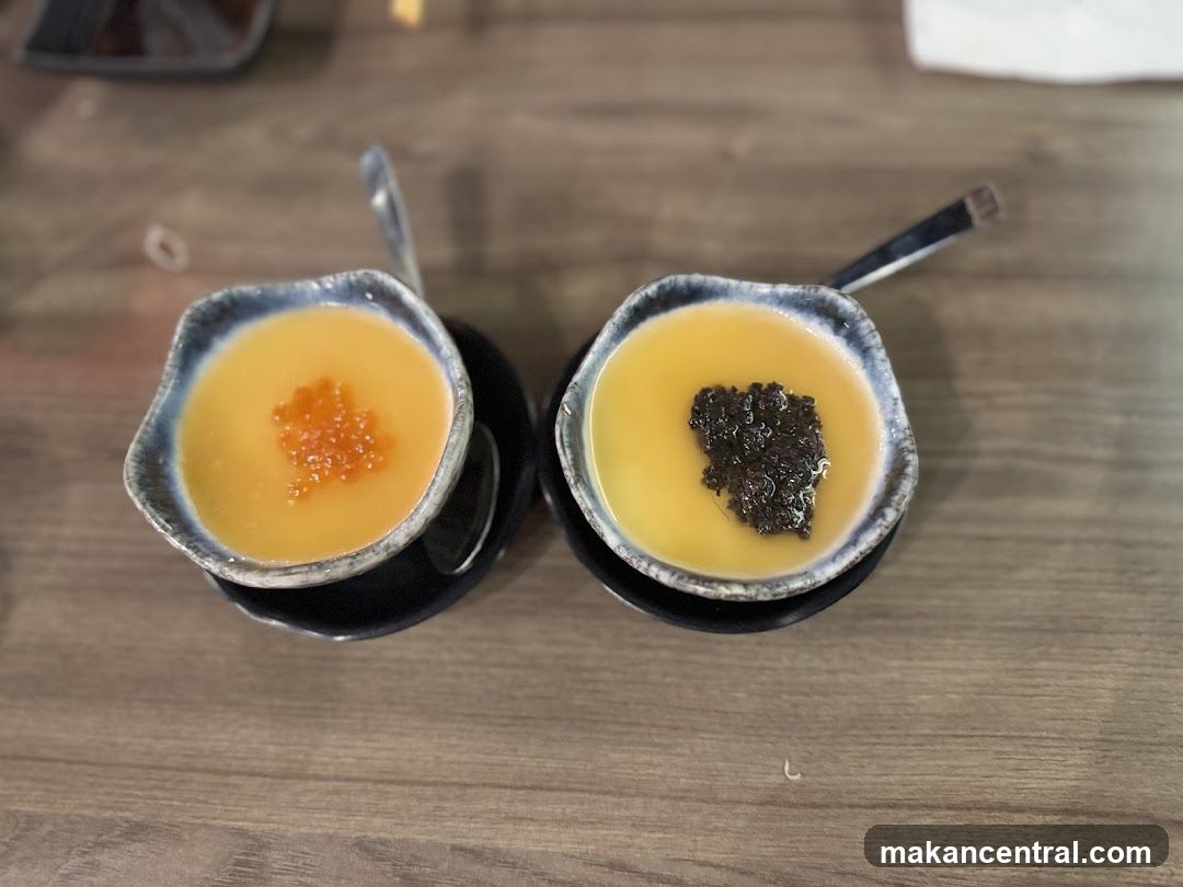 Two small bowls of soup with toppings
