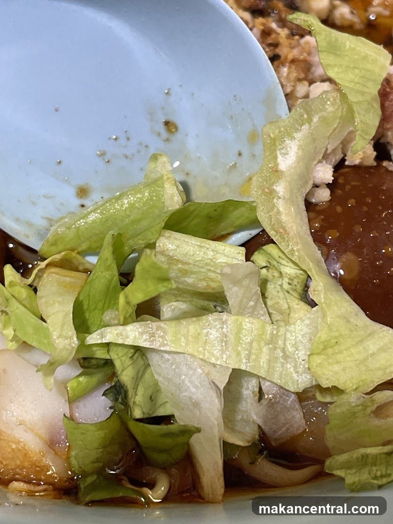 Close-up of a dish with lettuce and sauce