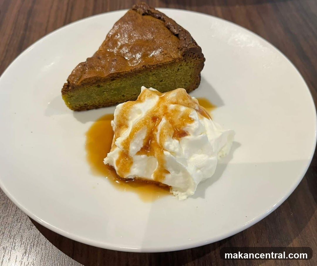 Slice of Green Tea Cake with Whipped Cream