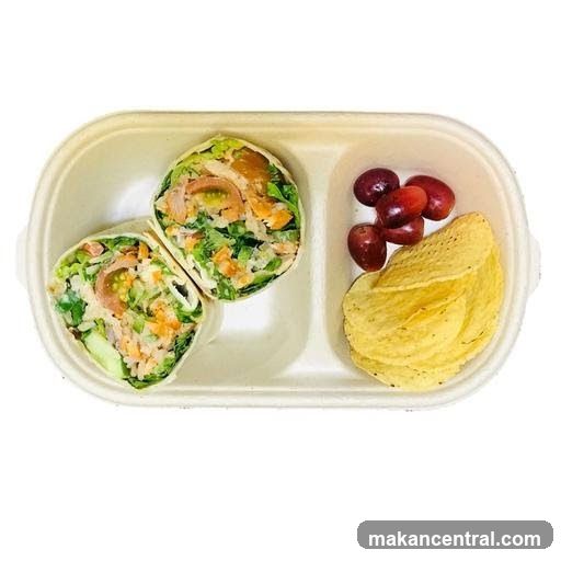 Salmon wrap with grapes and chips