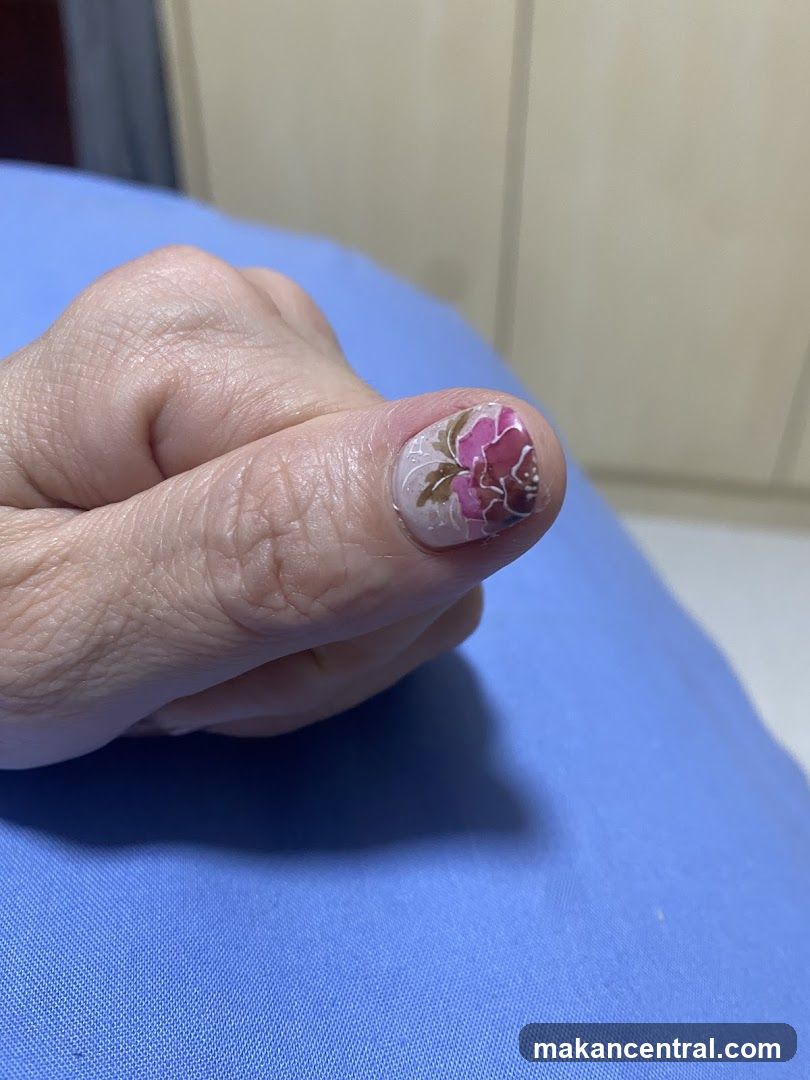 Thumb with Floral Nail Art
