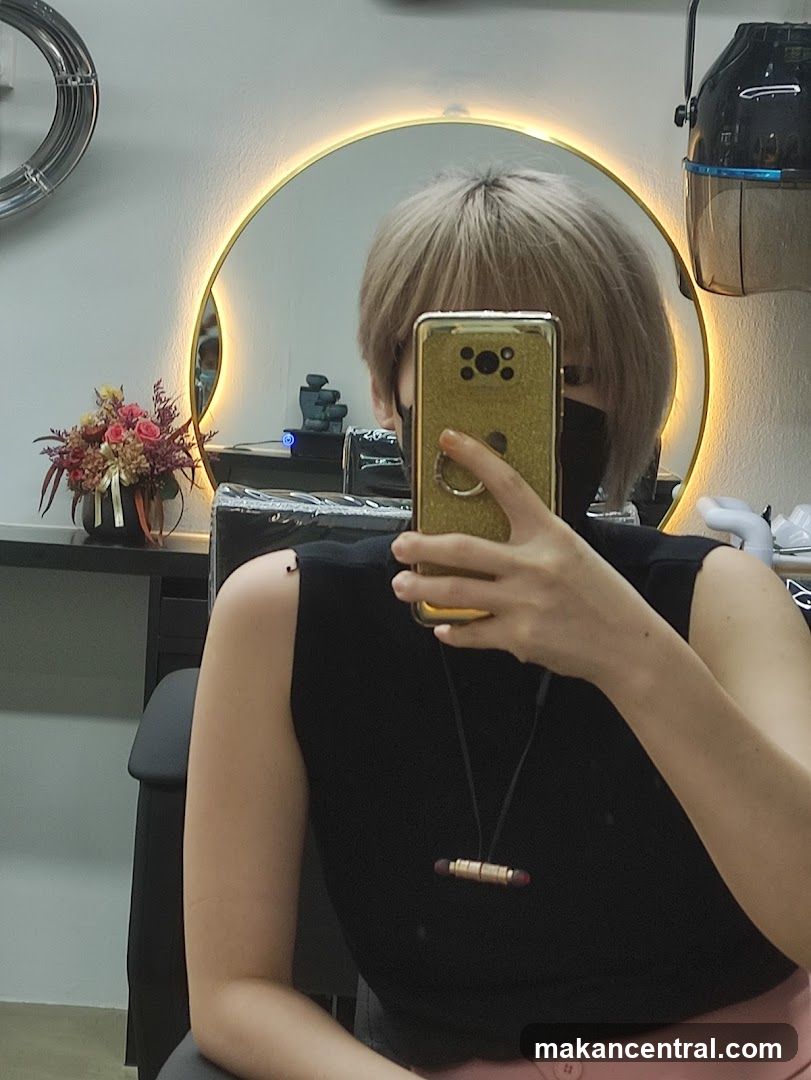 Woman taking a selfie in a salon