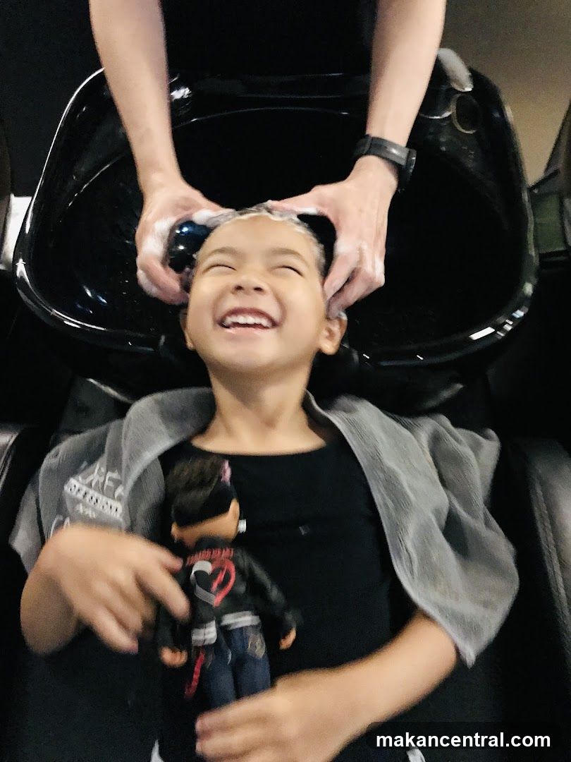 Child getting hair washed