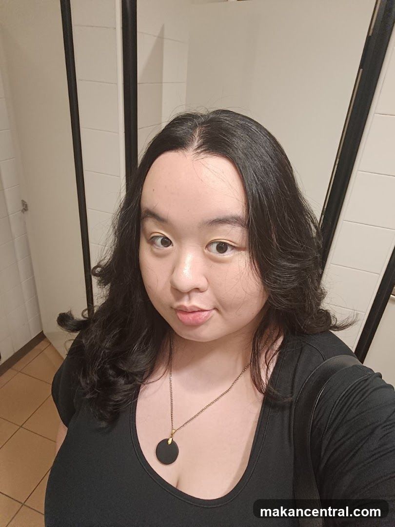 Self-portrait in a restroom