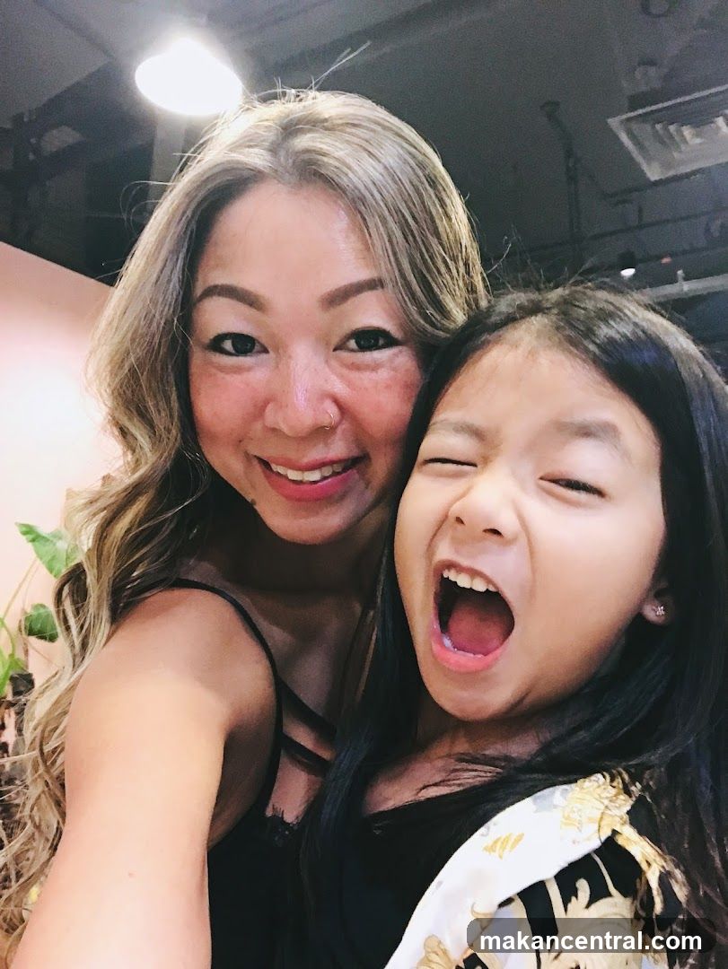 Woman and Child Posing for Selfie