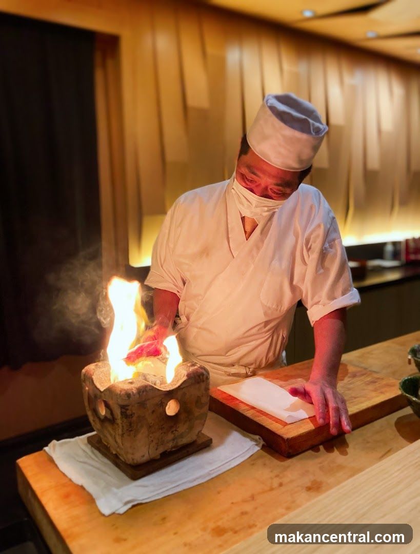 Chef preparing food with fire