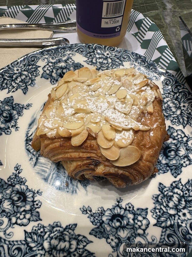Almond Croissant on Decorative Plate