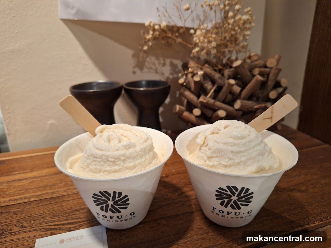 Two cups of soft serve ice cream