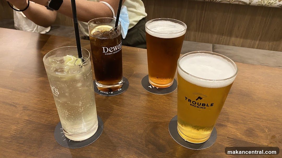 Four drinks on a wooden table