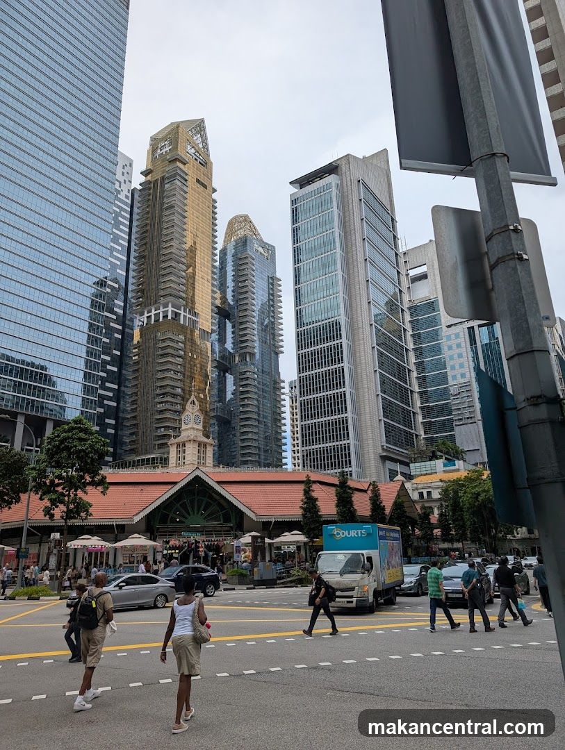 Street scene with modern skyscrapers and a historic building