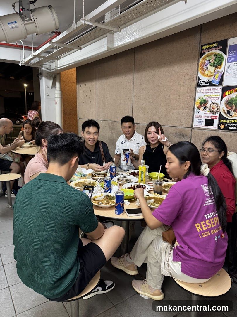 People Eating at a Food Stall