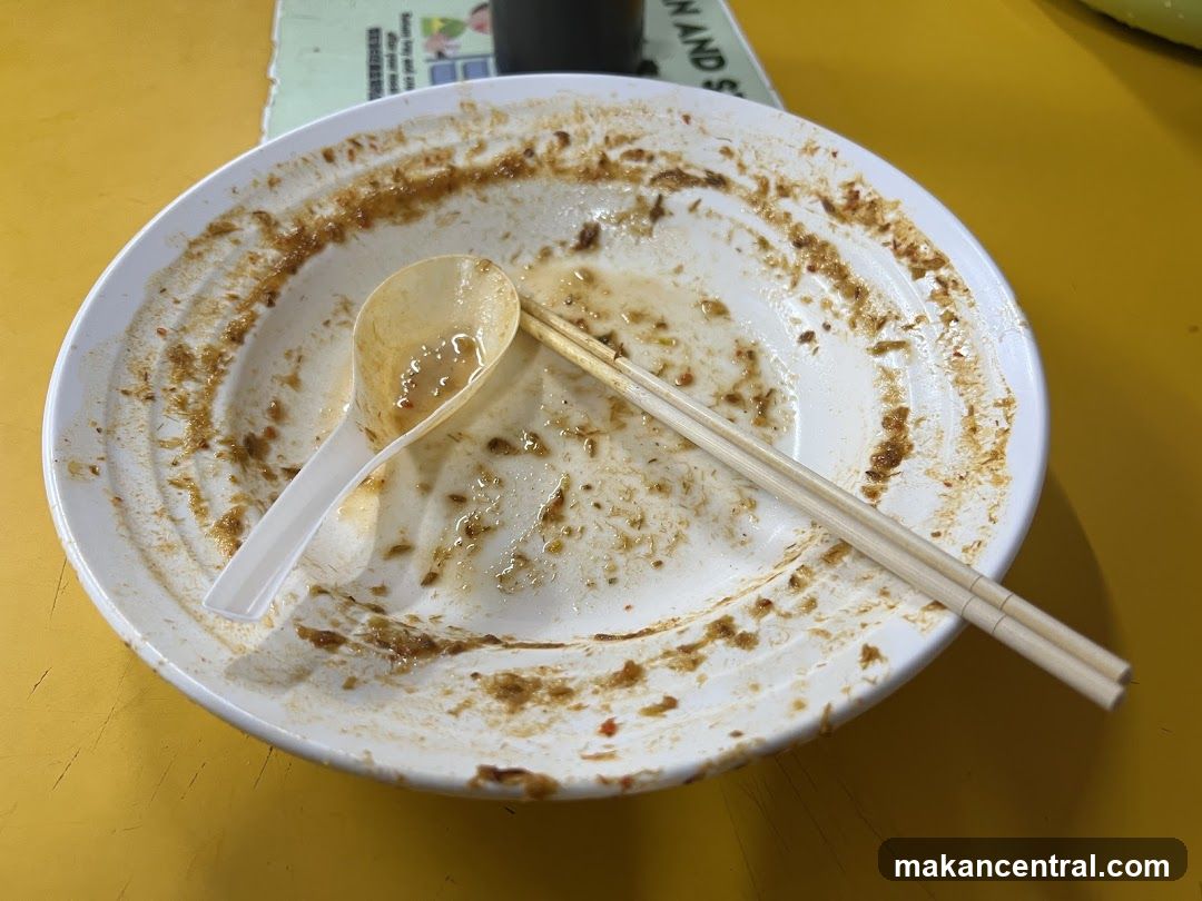 Dirty Bowl with Chopsticks and Spoon