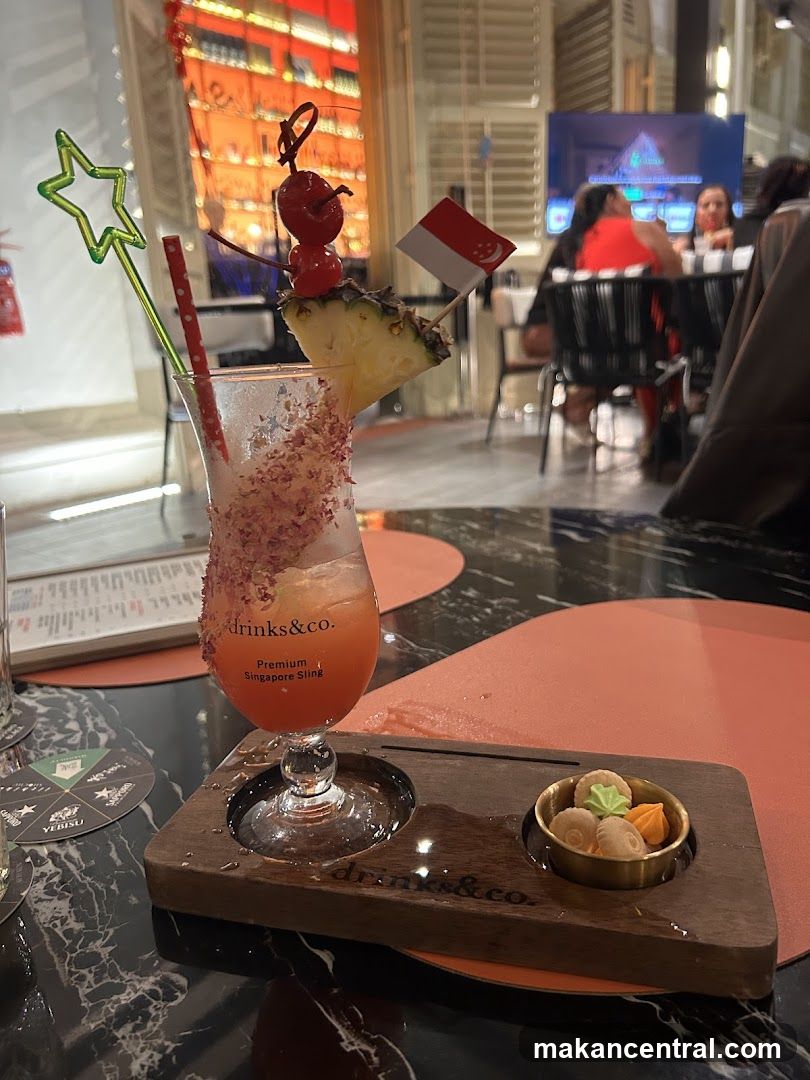 Cocktail with Pineapple and Cherry Garnish