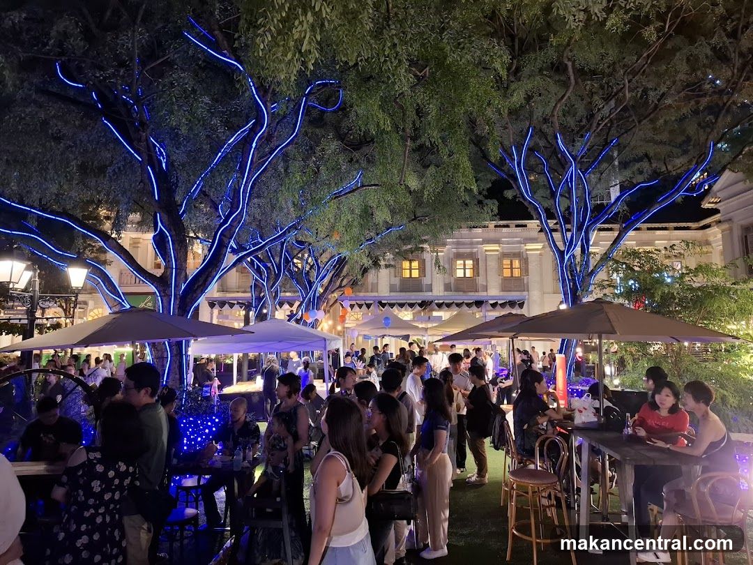 Outdoor Gathering with Blue Tree Lights