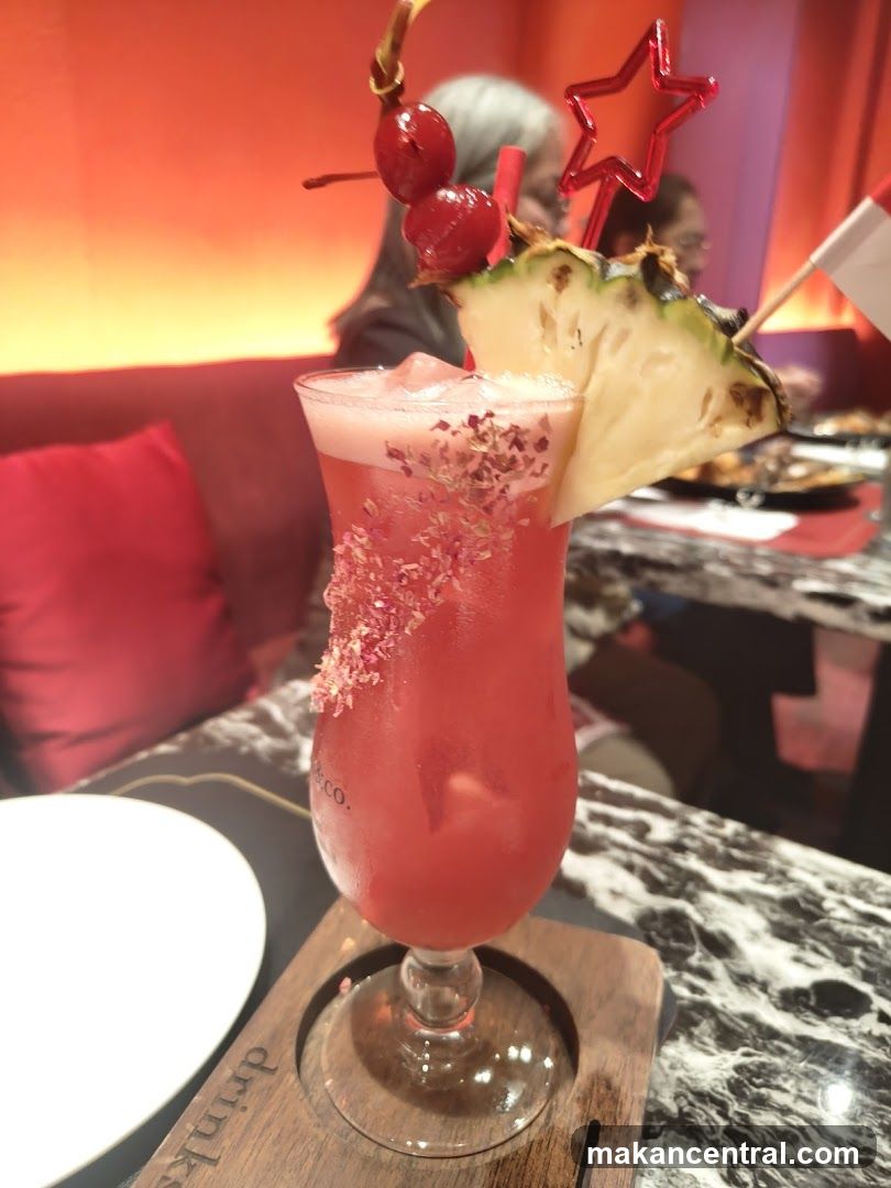 Cocktail with Pineapple and Cherries