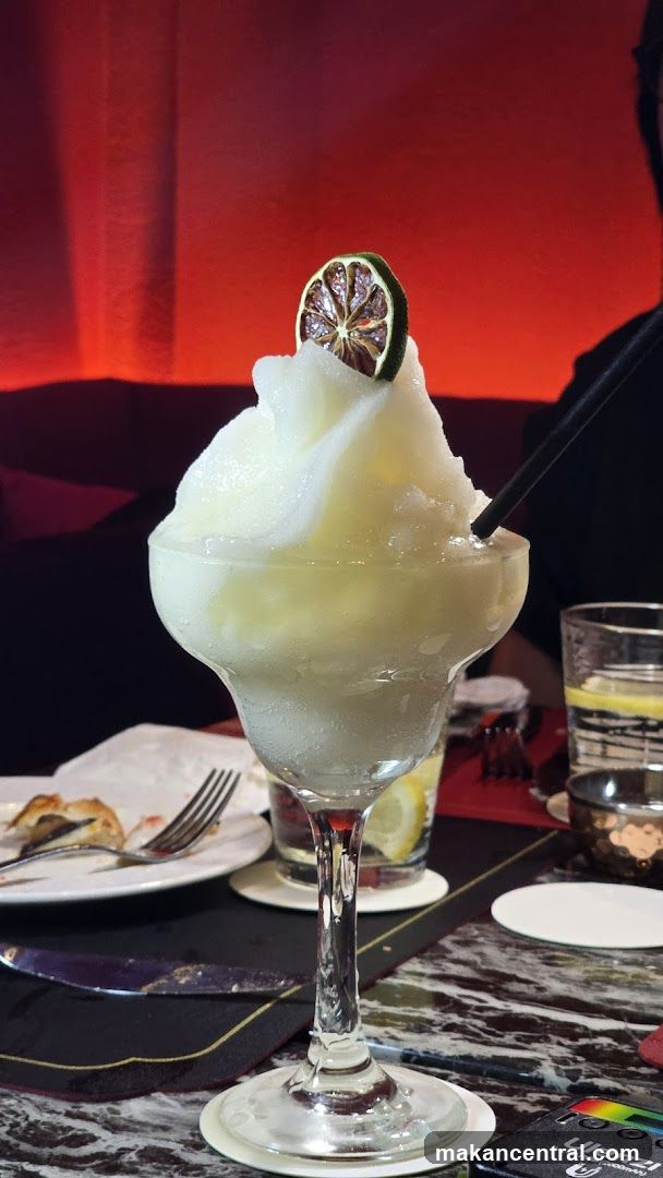 Frozen Cocktail with Lime Garnish