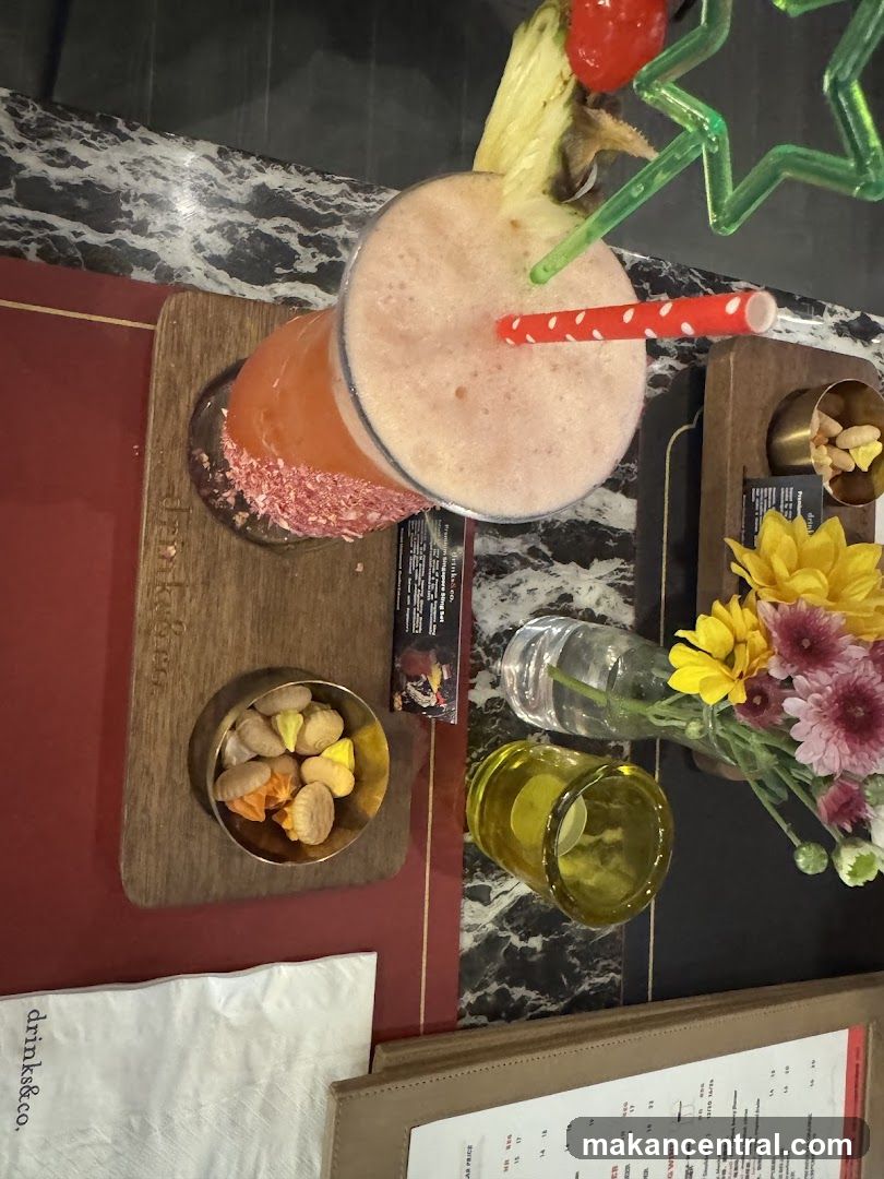 Cocktail with Pineapple and Cherry