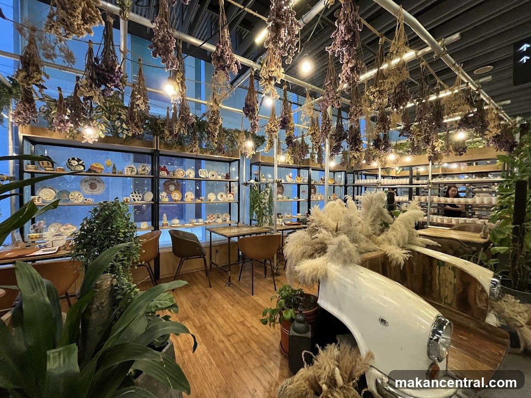 Interior of a cafe with dried flowers and decorative items