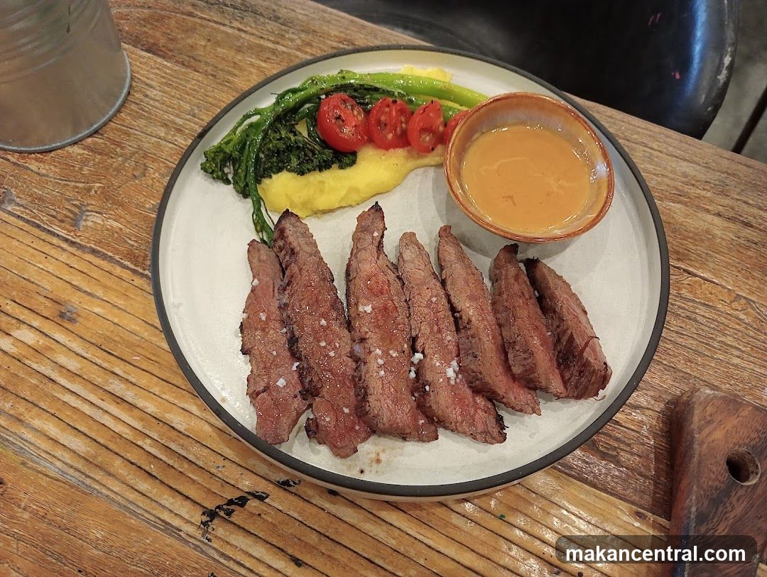 Sliced steak with sides