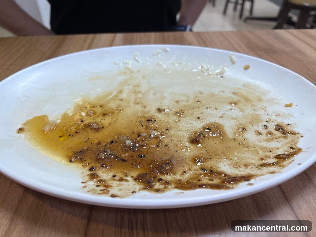 Dirty Plate with Food Scraps