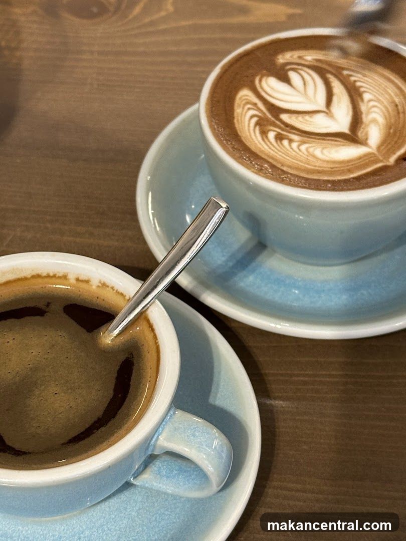 Two cups of coffee on a wooden table