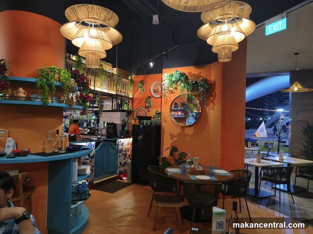 Restaurant Interior with Orange Walls and Woven Chandeliers