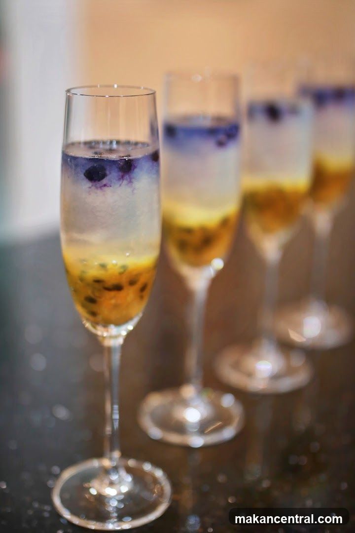 Layered Cocktails with Passion Fruit and Blueberries