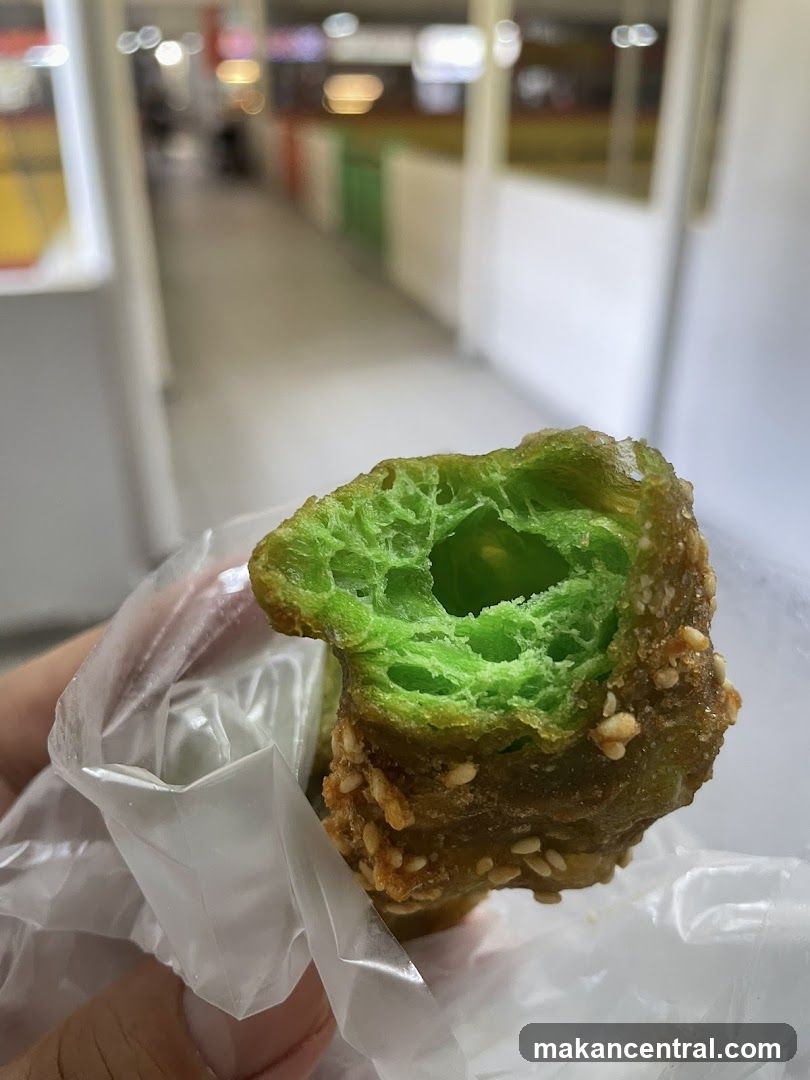 Hand holding green pastry