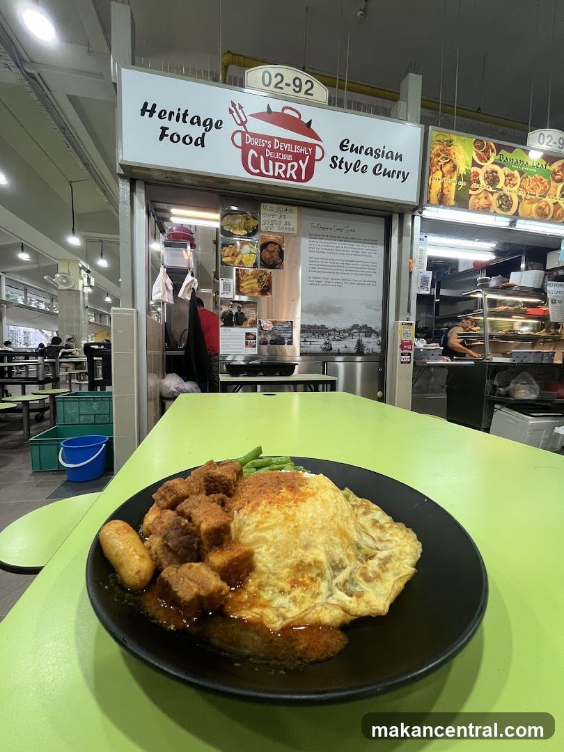 Food stall interior with curry dish on table
