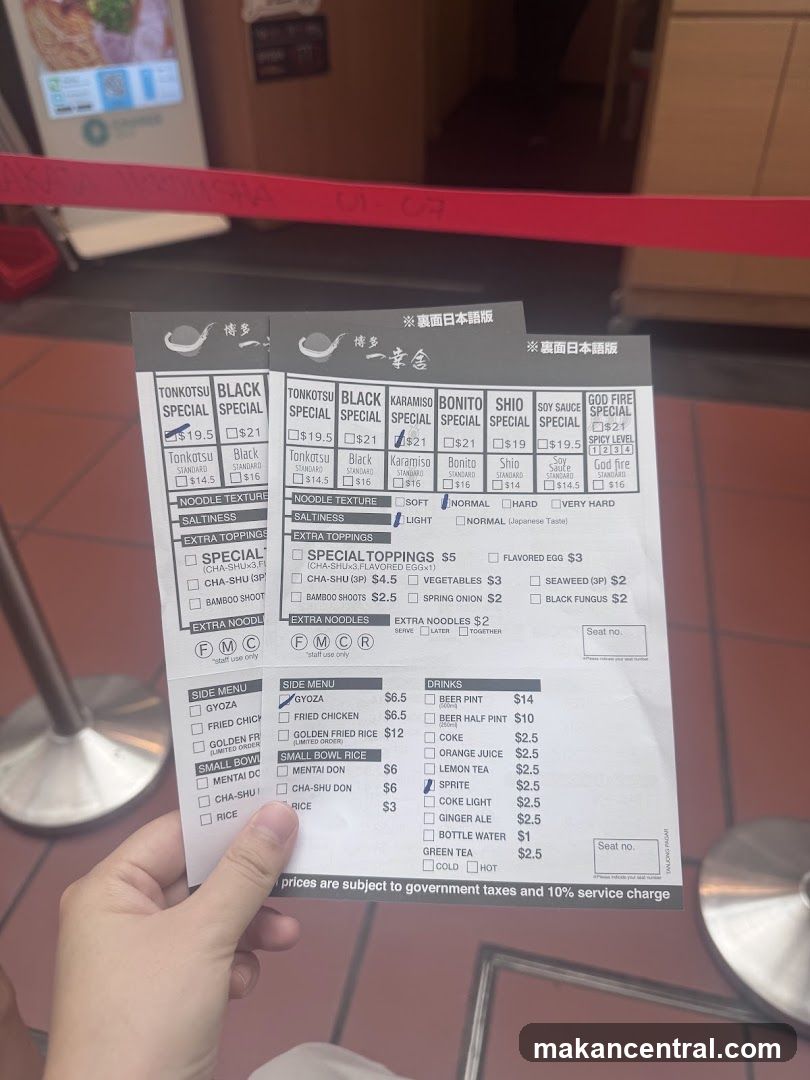 Hand holding menu at restaurant entrance