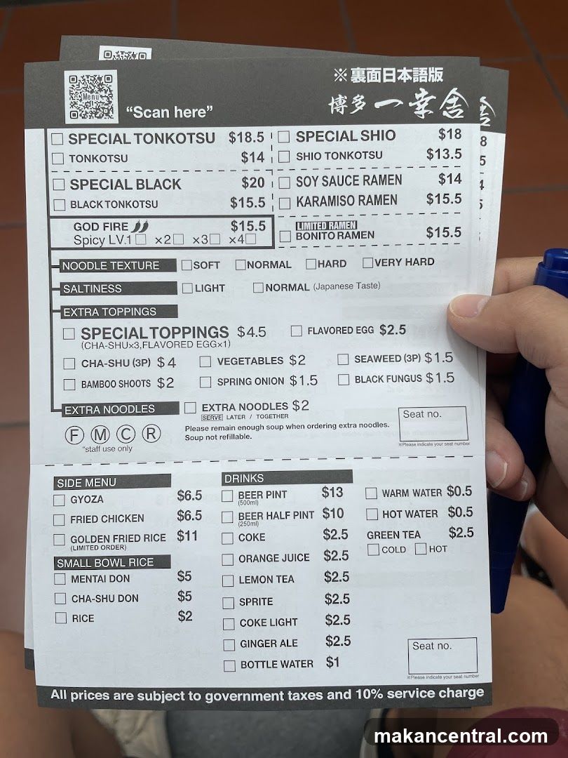 Hand holding ramen menu