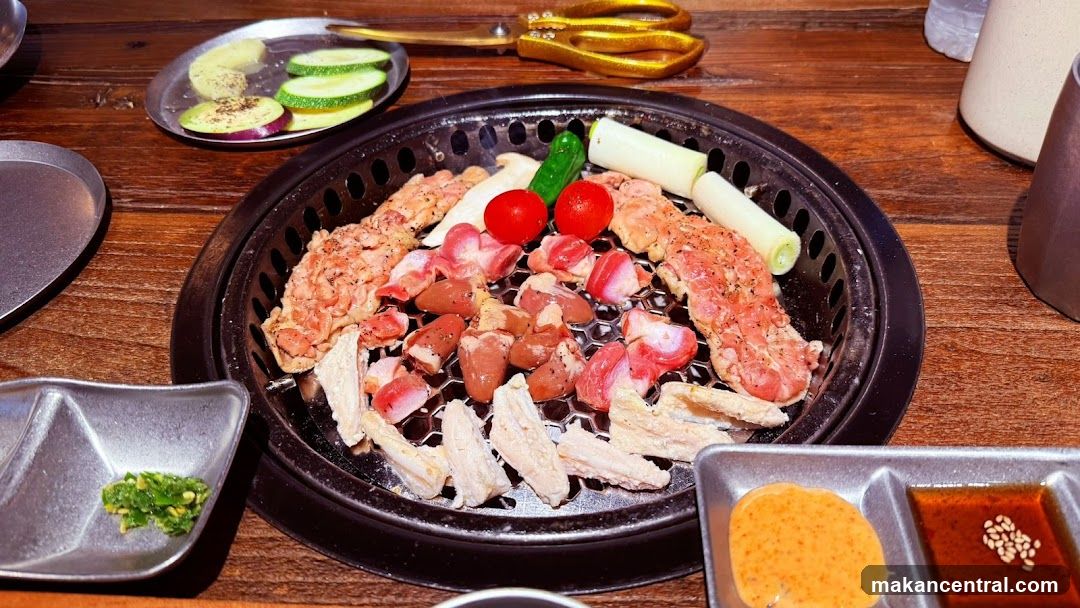 Grilled meat and vegetables on a Korean BBQ grill