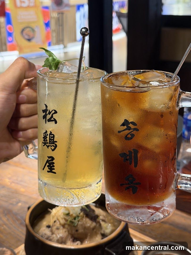 Two drinks with Korean script on mugs