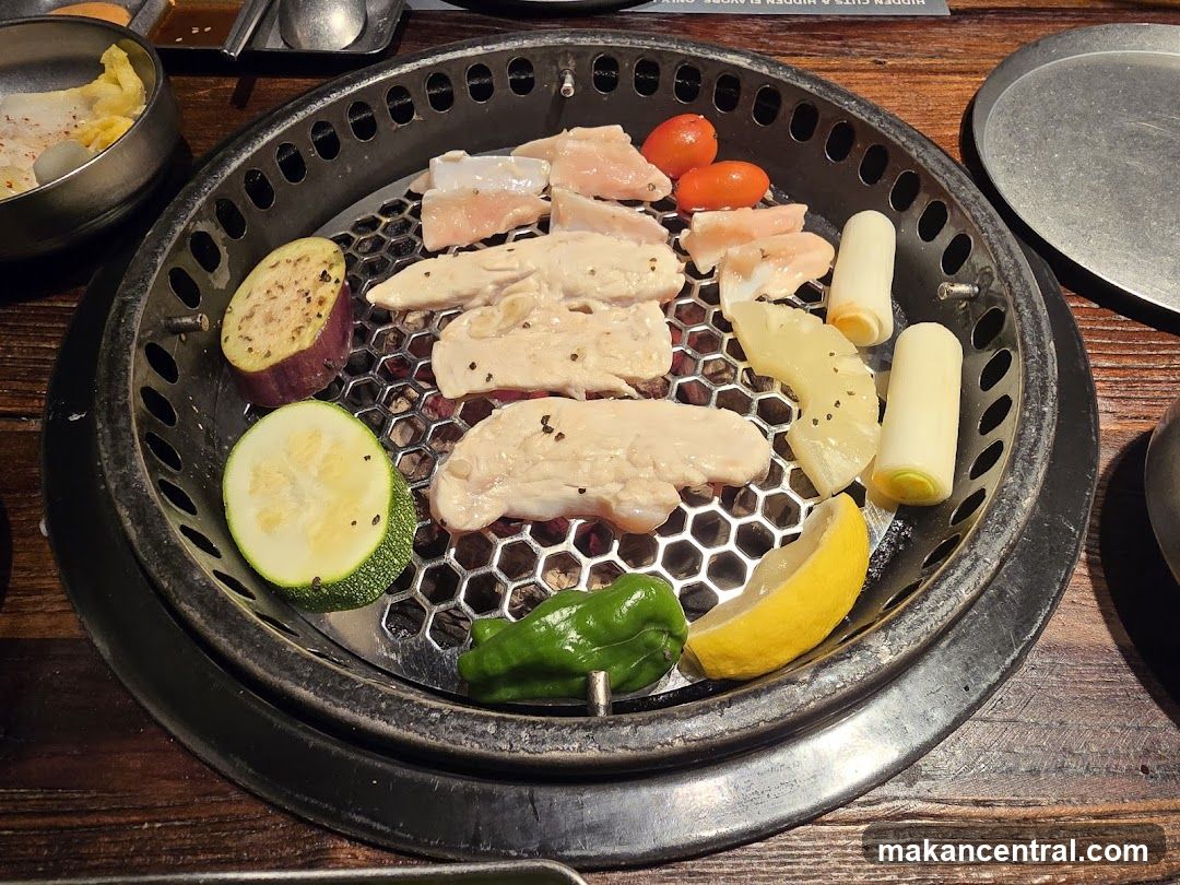 Grilled meat and vegetables on a barbecue grill