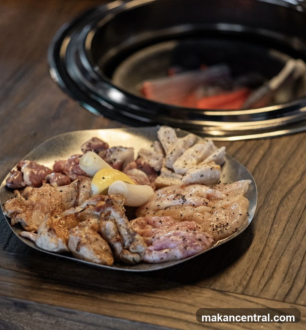 Grilled meat platter with barbecue setup
