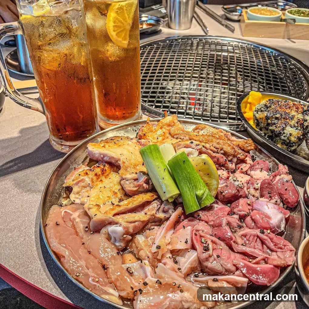 Grilled meat platter with beverages at a BBQ restaurant