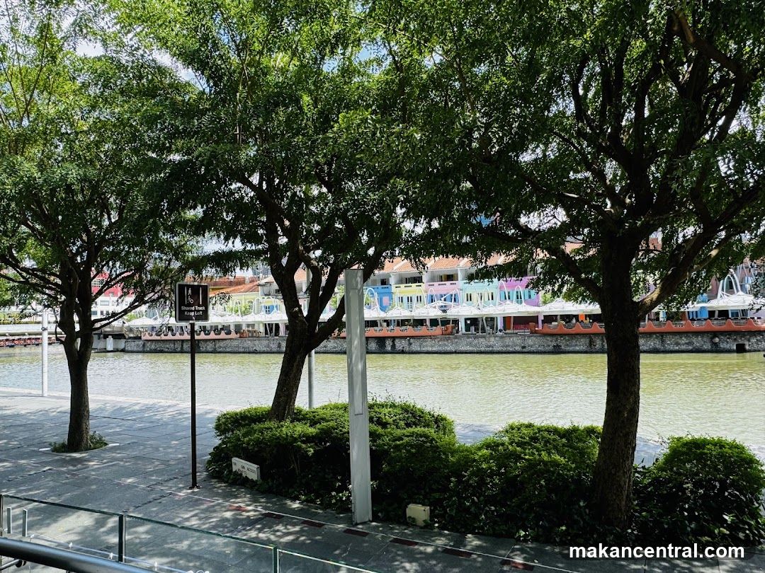 Riverfront promenade with colorful buildings