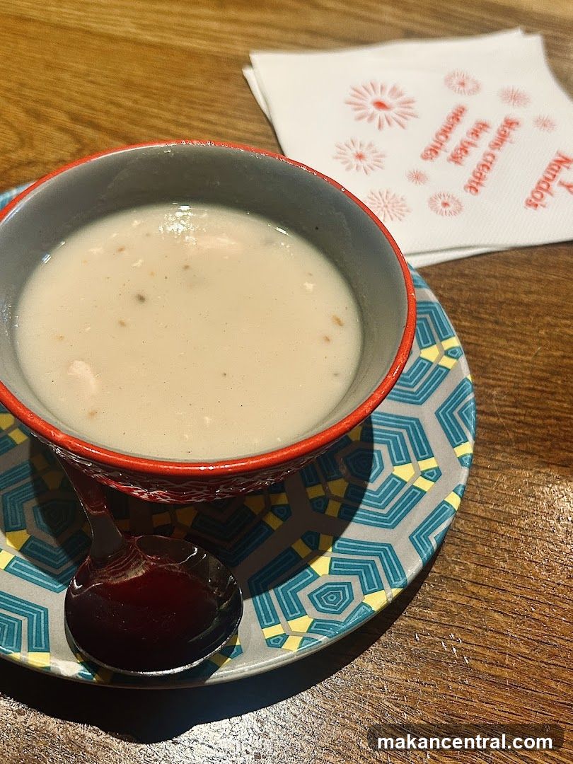 Soup served with patterned bowl and saucer