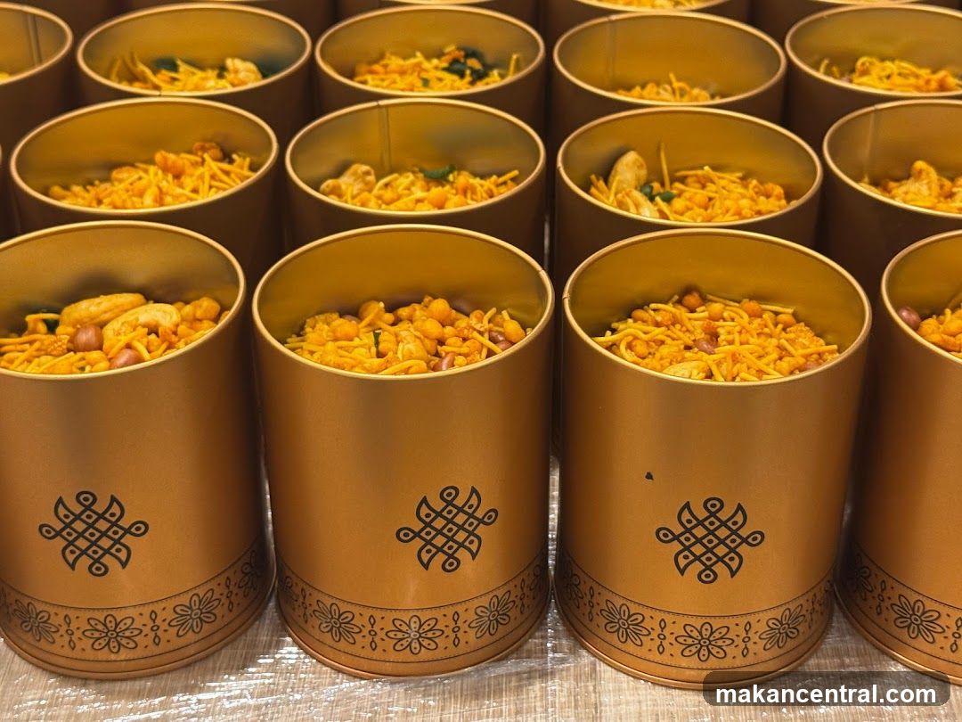Golden Cylindrical Containers with Spicy Snack Mix