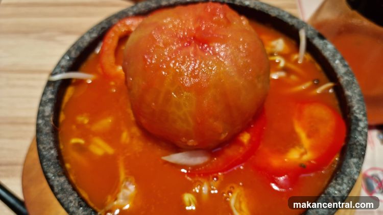Tomato-based dish in stone bowl