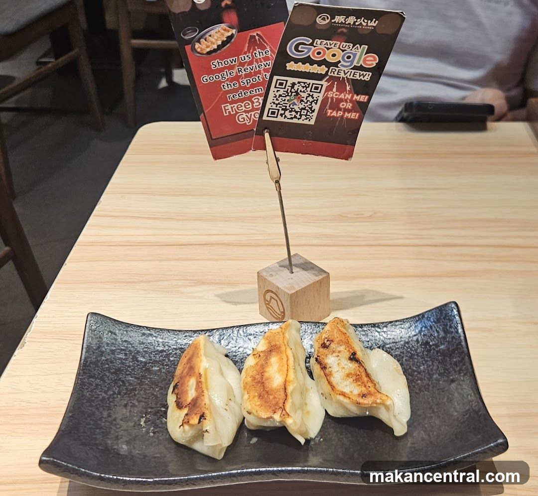 Dumplings on Plate with Review Sign