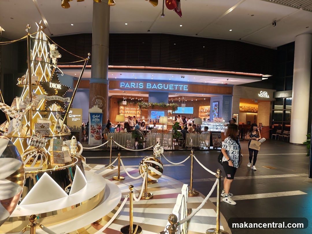 Interior of shopping mall with Paris Baguettes and Dior display